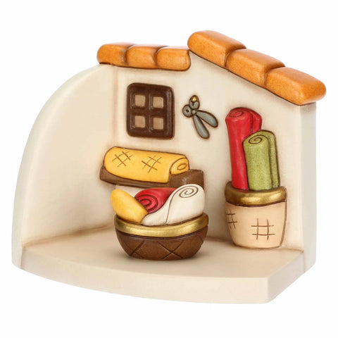 Bottega della sarta con cesti di stoffe  Thun