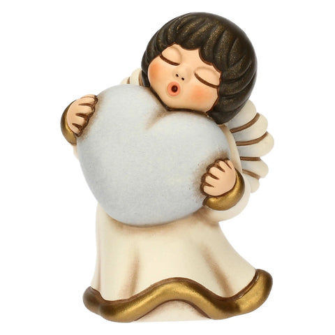 Angelo in ceramica con cuore azzurro