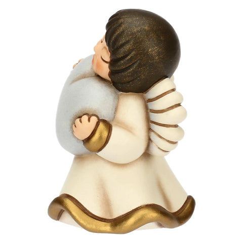 Angelo in ceramica con cuore azzurro