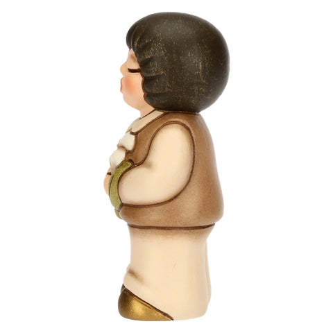 Bimbo in ceramica con giglio Thun