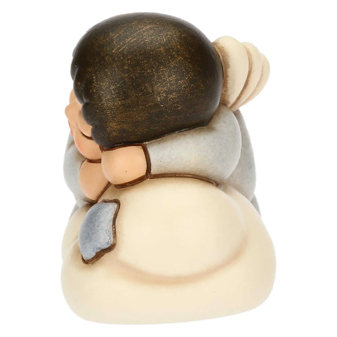 Angelo azzurro in ceramica su nuvola