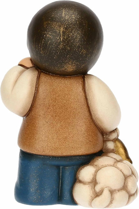 Bimbo con lanterna in ceramica BLU