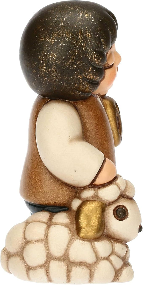 Bimbo con lanterna in ceramica BLU